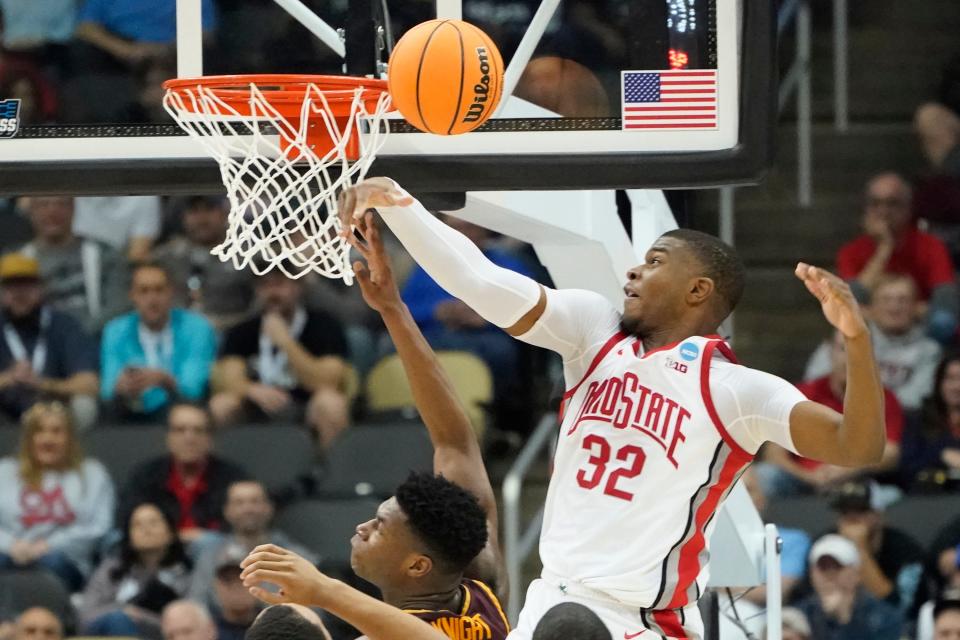 Ohio State's E.J. Liddell (32) blocks a shot by Loyola Chicago's Chris Knight during the first half of a college basketball game in the first round of the NCAA tournament, Friday, March 18, 2022, in Pittsburgh. (AP Photo/Keith Srakocic)