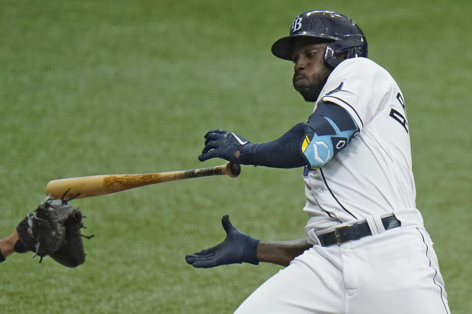 Tampa Bay Rays' Randy Arozarena drops his bat as he ducks away from an inside pitch by New York Yankees' Corey Kluber during the third inning of a baseball game Friday, April 9, 2021, in St. Petersburg, Fla. (AP Photo/Chris O'Meara)