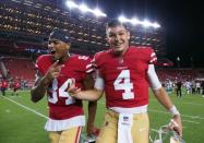 Aug 9, 2018; Santa Clara, CA, USA; San Francisco 49ers wide receiver Richie James (82) and quarterback Nick Mullens (4) celebrate after the win against the Dallas Cowboys at Levi's Stadium. Kelley L Cox-USA TODAY Sports