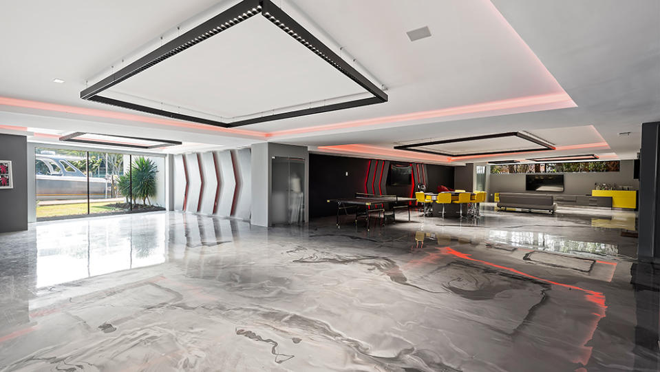 The futuristic garage, which can hold 12 cars - Credit: Photo: Courtesy of ONE Sotheby's International Realty