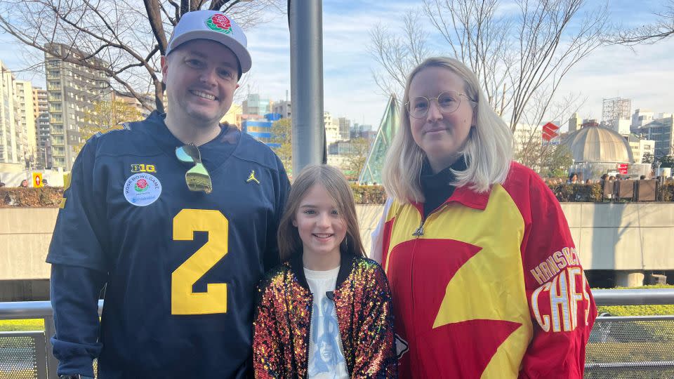 Tricia Mears(right), from the US, watches the concert with his brother and his daughter. - Saki Toi/CNN