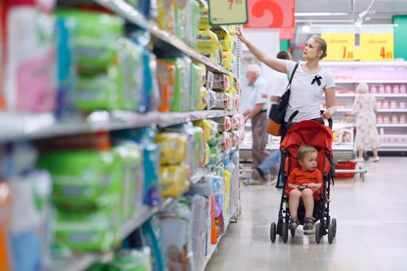 A mother shops for diapers.