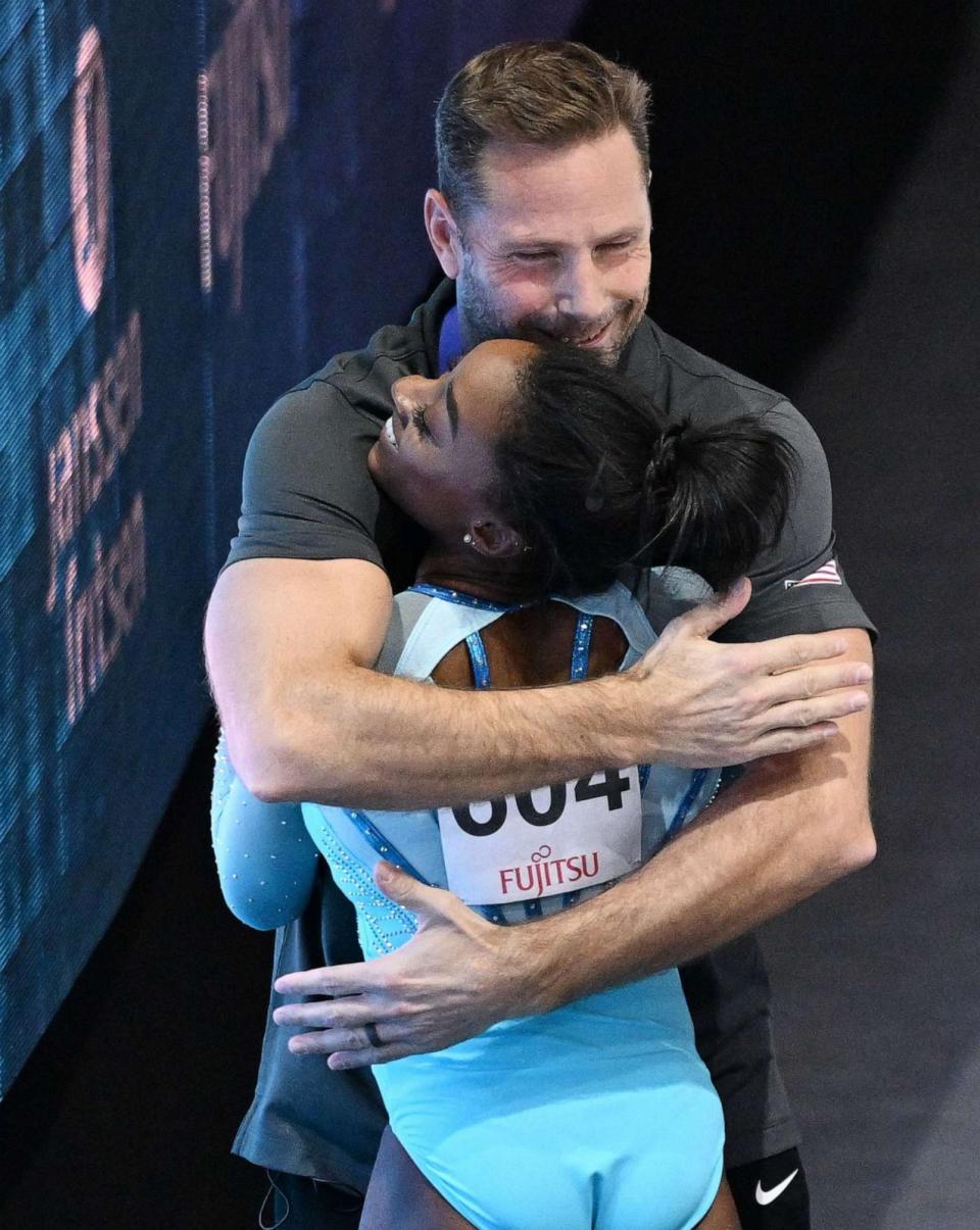 PHOTO: Simone Biles celebrates with coach Laurent Landi after landing a double pike vault during the Women's Vault Qualification, Oct. 1, 2023, during the FIG Artistic Gymnastics World Championships in Antwerp, Belgium. (Kenjiro Matsuo/AFLO/Shutterstock)