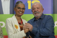 FILE - Brazil's former President Luiz Inacio Lula da Silva, who is running for reelection, right, and congressional candidate Marina Silva, campaign in Sao Paulo, Brazil, Sept. 12, 2022. Brazil's President-elect Luiz Inacio Lula da Silva named Silva as environment minister for his incoming government, indicating he will prioritize cracking down on illegal deforestation in the Amazon. (AP Photo/Andre Penner, File)