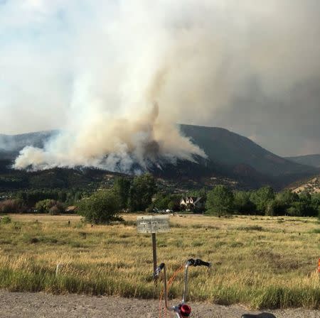 Fire is seen in Basalt, Colorado, U.S., July 4, 2018 in this picture obtained from social media. Picture taken July 4, 2018. NICK BLASTOS/via REUTERS