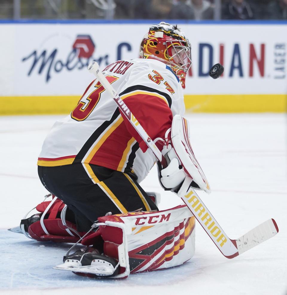 Calgary Flames goalie David Rittich, of the Czech Republic, makes a save against the Edmonton Oilers during the second period of an NHL hockey game Friday, Dec. 27, 2019, in Edmonton, Alberta. (Darryl Dyck/The Canadian Press via AP)