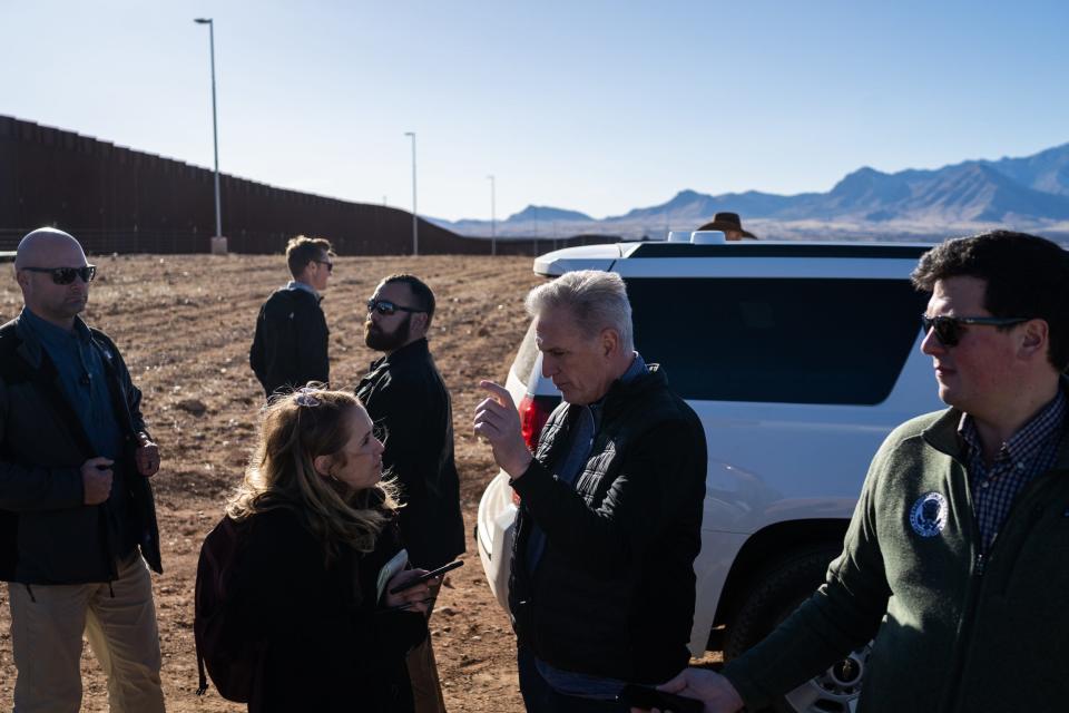 U.S. House Speaker Kevin McCarthy answers questions from reporters after a news conference in front of the U.S.-Mexico border south of Sierra Vista on Feb. 16, 2023, in Hereford.