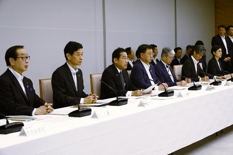 Japanese Prime Minister Fumio Kishida, third left, speaks during a meeting with representatives of the Inter-Ministerial Council for Contaminated Water, Treated Water and Decommissioning Issues and the Inter-Ministerial Council Concerning the Continuous Implementation of the Basic Policy on Handling of Advanced Liquid Processing System (ALPS) Treated Water, at the prime minister's office in Tokyo Tuesday, Aug. 22, 2023. (Rodrigo Reyes Marin/Pool Photo via AP)