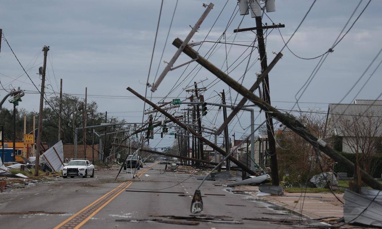 <span>A street strewn with downed power lines after Hurricane Laura passed through the area on 27 August 2020 in Lake Charles, Louisiana.</span><span>Photograph: Joe Raedle/Getty Images</span>
