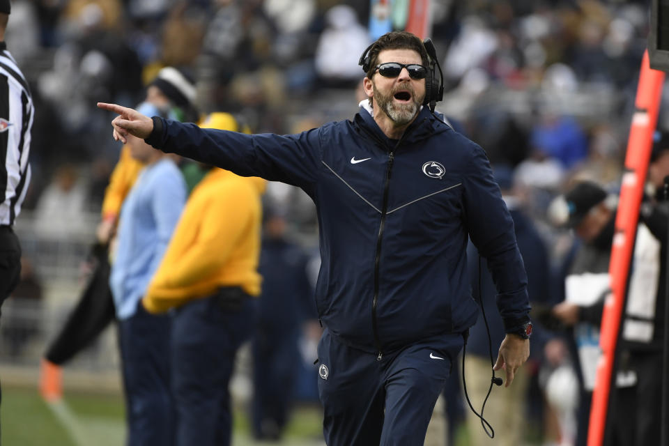 FILE - Penn State defensive coordinator Brent Pry gestures during the second half of an NCAA college football game against Rutgers in State College, Pa., Saturday, Nov. 20, 2021. Virginia Tech is finalizing a deal to make Penn State defensive coordinator Brent Pry its next head coach, two people familiar with the situation told The Associated Press. The people spoke to the AP on condition of anonymity Tuesday, Nov. 30, because details were still being worked out and neither school was prepared to make a formal announcement. (AP Photo/Barry Reeger, File)