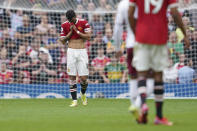 Manchester United's Bruno Fernandes reacts after missing a penalty shot during the English Premier League soccer match between Manchester United and Aston Villa at the Old Trafford stadium in Manchester, England, Saturday, Sept 25, 2021. (AP Photo/Jon Super)