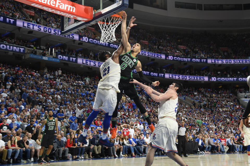 Jayson Tatum misses his monster dunk attempt over Joel Embiid on Saturday night. (Getty)