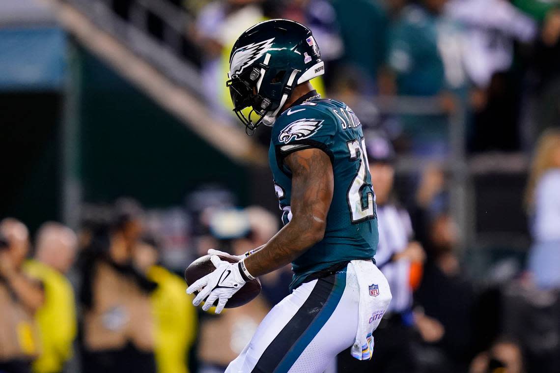 Philadelphia Eagles’ Miles Sanders celebrates a touchdown during the first half of an NFL football game against the Dallas Cowboys on Sunday, Oct. 16, 2022, in Philadelphia.