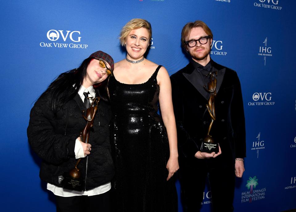 PALM SPRINGS, CALIFORNIA - JANUARY 04: Billie Eilish and FINNEAS, winners of the Chairman’s Award for "Barbie," and Greta Gerwig (C) pose backstage during the 35th Annual Palm Springs International Film Awards at Palm Springs Convention Center on January 04, 2024 in Palm Springs, California.
