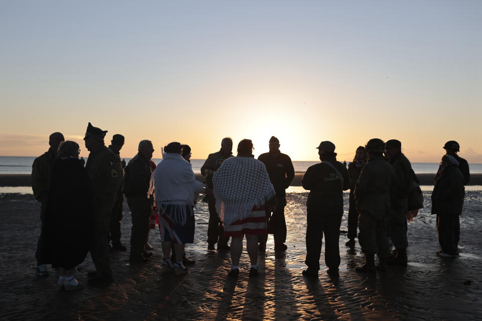 World War II reenactors gather on Omaha Beach during a D-Day commemoration ceremony of the 78th anniversary for those who helped end World War II, in Saint-Laurent-sur-Mer, Normandy, France, Monday, June 6, 2022. (AP Photo/Jeremias Gonzalez)