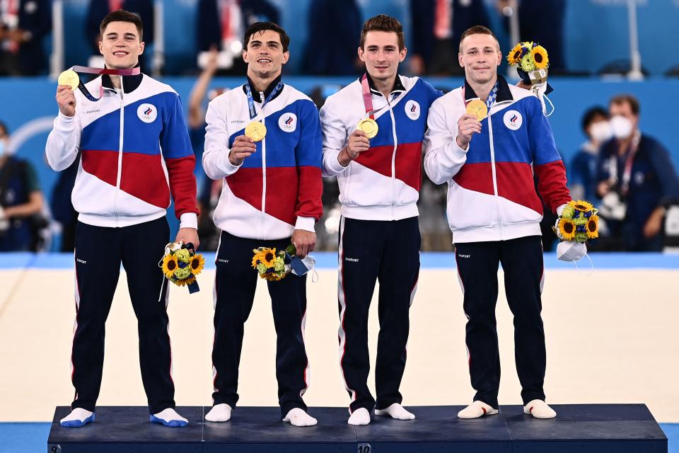 (From R) Gold medalits Russia's David Belyavskiy, Russia's Denis Abliazin, Russia's Artur Dalaloyan and Russia's Nikita Nagornyy celebrate on the podium after winning the artistic gymnastics men's team final during the Tokyo 2020 Olympic Games at the Ariake Gymnastics Centre in Tokyo on July 26, 2021. (Photo by Loic VENANCE / AFP) (Photo by LOIC VENANCE/AFP via Getty Images)