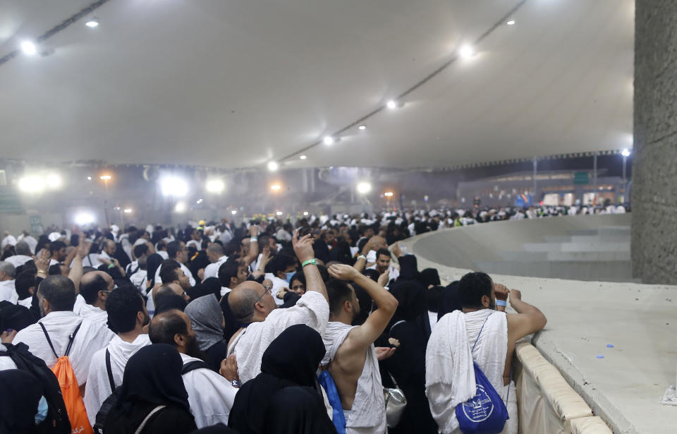 Muslim pilgrims cast stones at a pillar symbolizing the stoning of Satan, in a ritual called "Jamarat," the last rite of the annual hajj, on the first day of Eid al-Adha, in Mina near the holy city of Mecca, Saudi Arabia, Sunday, Aug. 11, 2019. The hajj is required of all Muslims to perform once in their lifetime if they are financially and physically able. (AP Photo/Amr Nabil)