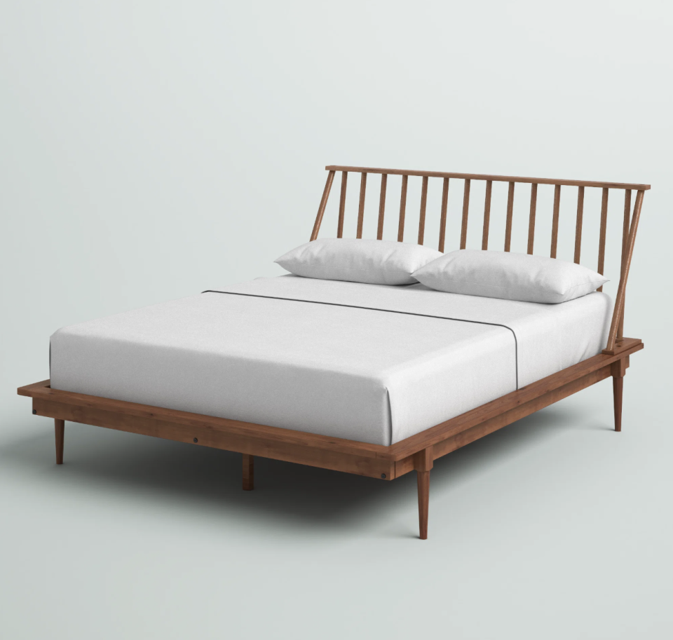Henline Solid Wood Spindle Bed (photo via Wayfair)