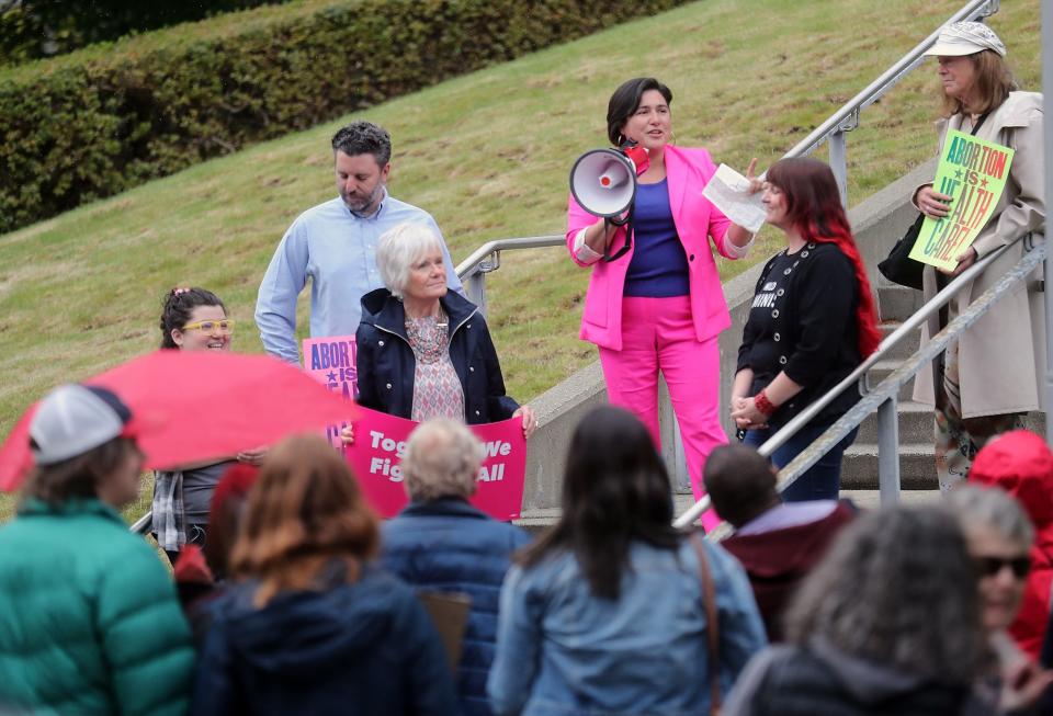 FILE ⁠— State Sen. Emily Randall uses a megaphone to address the crowd gathered during the Rally for Reproductive Rights in Bremerton in May.