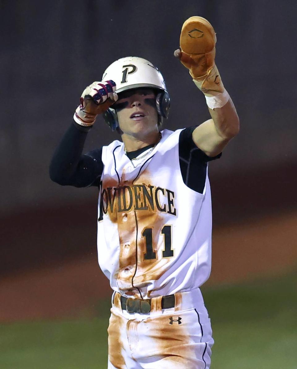 Providence Panthers shortstop Xavier McCoury points to his dugout after sliding headfirst into third base during action against Hopewell on Friday, April 12, 2024.