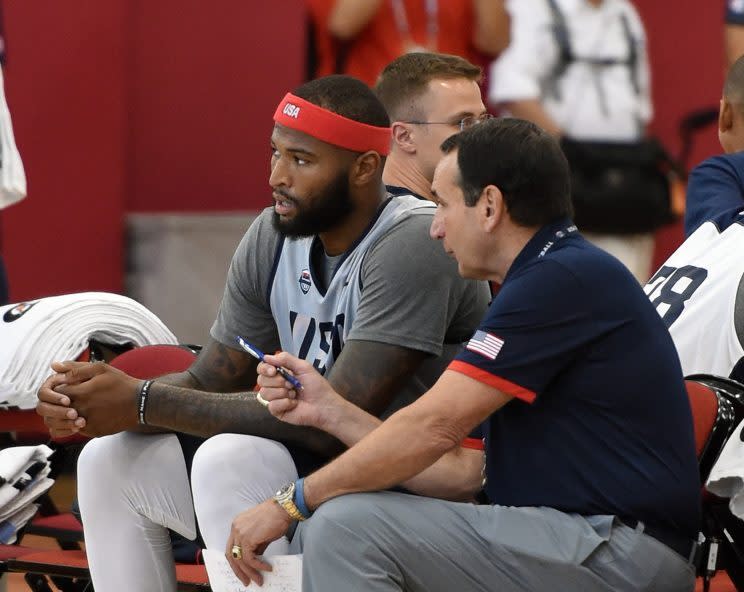 DeMarcus Cousins talks with coach Mike Krzyzewski at Team USA practice. (Getty)