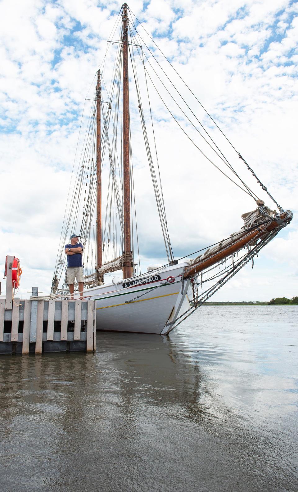 AJ Meerwald engineer Ken Haney stands next to the AJ Meerwald as the 1928-vintage oyster schooner, that recently received a major overhaul, is docked at the Bayshore Center at Bivalve in Port Norris, NJ, on Tuesday, August 16, 2022.  