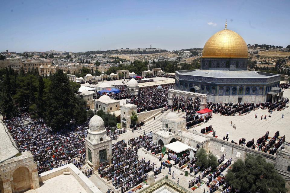 FILE - In this June 17, 2016 file photo, Palestinians pray in the Al Aqsa Mosque compound during the Muslim holy month of Ramadan, in Jerusalem's Old City. The Palestinians are ringing alarm bells over Donald Trump's stated intention to relocate the U.S. Embassy in Israel to contested Jerusalem, fearing quick action once he takes office as U.S. president next week. They say an embassy move would kill any hopes for negotiating an Israeli-Palestinian border deal and rile the region by undercutting Muslim and Christian claims to the holy city. (AP Photo/Mahmoud Illean, File)