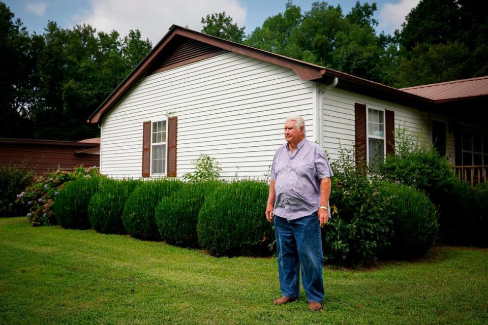 Johnny “Van” Garris, pictured outside his house in Anson County, N.C., says the many industrial-scale poultry farms that have cropped up near his home have brought strong odors and buzzards, disrupting his family’s quality of life.