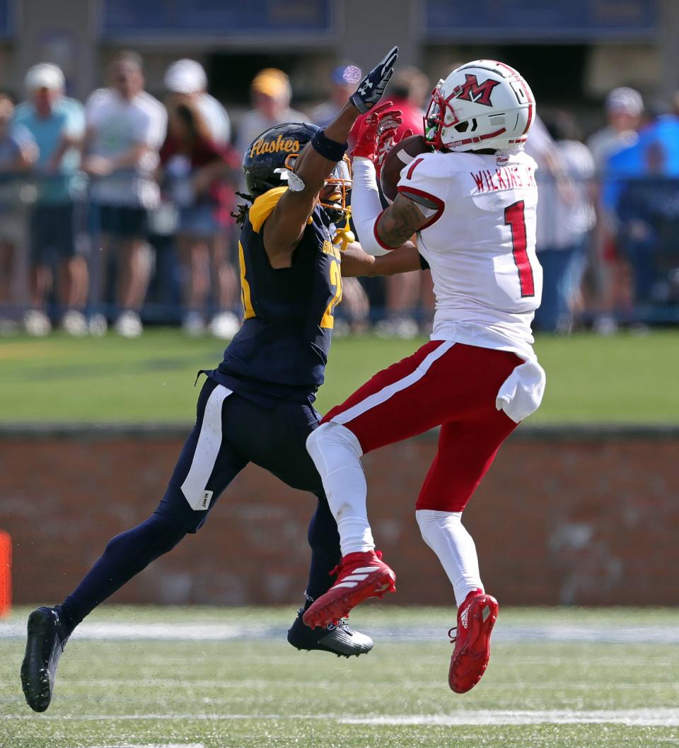 Miami (OH) RedHawks wide receiver Joe Wilkins Jr. (1) catches a pass for first down against Kent State Golden Flashes cornerback Alex Branch (28) during the second half of Miami's 23-3 victory.