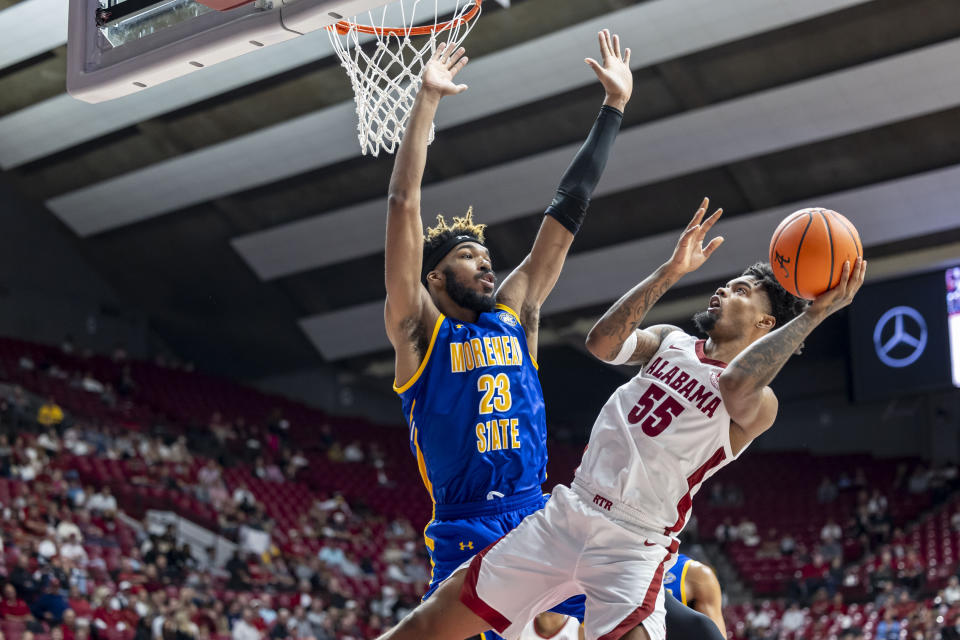 Alabama guard Aaron Estrada (55) shoots for a score on a fallaway as Morehead State forward Dieonte Miles (23) defends during the first half of an NCAA college basketball game, Monday, Nov. 6, 2023, in Tuscaloosa, Ala. (AP Photo/Vasha Hunt)