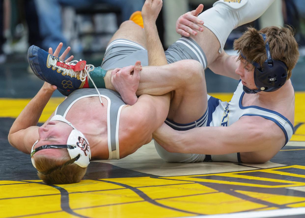 Hartland's Dallas Korponic (right) defeated Brighton's Easton Hardesty for the 132-pound championship in the KLAA wrestling tournament Saturday, Feb. 3, 2024.