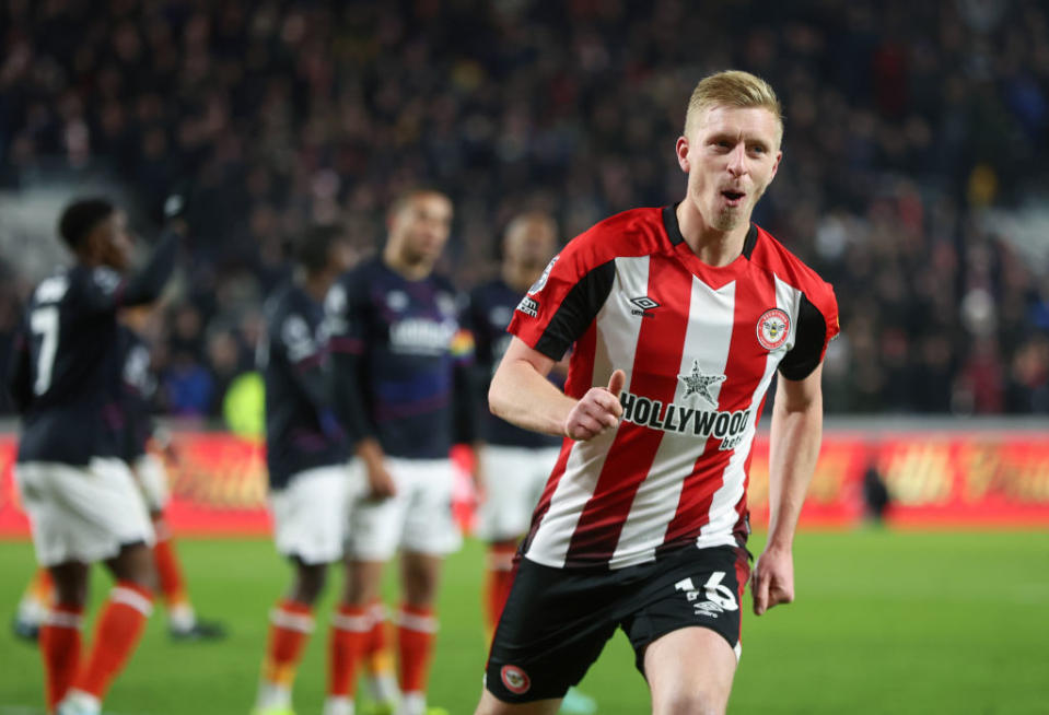 BRENTFORD, ENGLAND - DECEMBER 2: Brentford's Ben Mee celebrates scoring his side's second goal during the Premier League match between Brentford FC and Luton Town at Gtech Community Stadium on December 2, 2023 in Brentford, England. (Photo by Rob Newell - CameraSport via Getty Images)