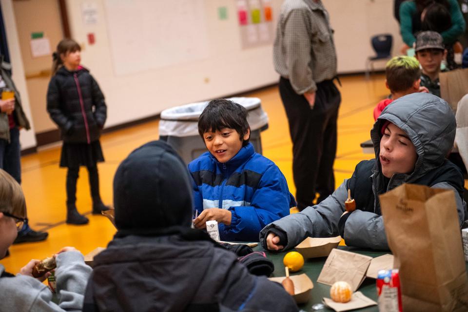 Students eat breakfast before classes at Red Feather Lakes Elementary School in Red Feather Lakes, Colo., on Monday, Dec. 4, 2023.