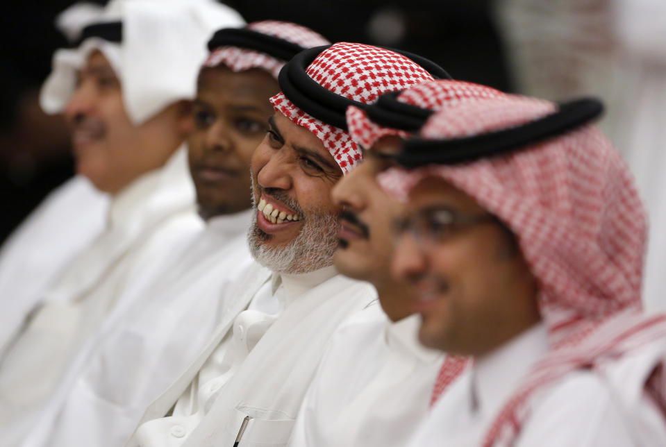 Saudis smiles during a press conference after Energy Minister Prince Abdulaziz bin Salman announced that 50% of its daily crude oil production that was knocked out by a weekend attack had been restored during a press conference in Jiddah, Saudi Arabia, Tuesday, Sept. 17, 2019. (AP Photo/Amr Nabil)