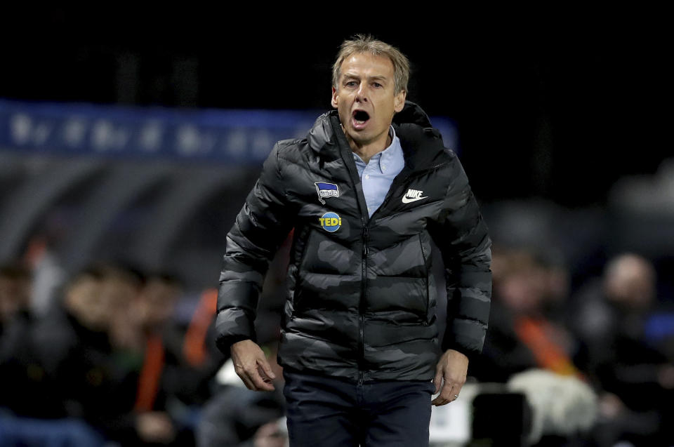 In this Saturday, Dec. 21, 2019 photo Hertha's head coach Juergen Klinsmann shouts during the German Bundesliga soccer match between Hertha BSC Berlin and Borussia Moenchengladbach in Berlin, Germany. (AP Photo/Michael Sohn)