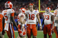 Clemson quarterback Trevor Lawrence (16) smiles after Clemson defeated Ohio State 29-23 in the Fiesta Bowl NCAA college football playoff semifinal Saturday, Dec. 28, 2019, in Glendale, Ariz. (AP Photo/Ross D. Franklin)