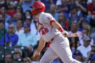 St. Louis Cardinals' Paul Goldschmidt watches his one-run single during the sixth inning in the first baseball game of a doubleheader against the Chicago Cubs in Chicago, Friday, Sept. 24, 2021. (AP Photo/Nam Y. Huh)