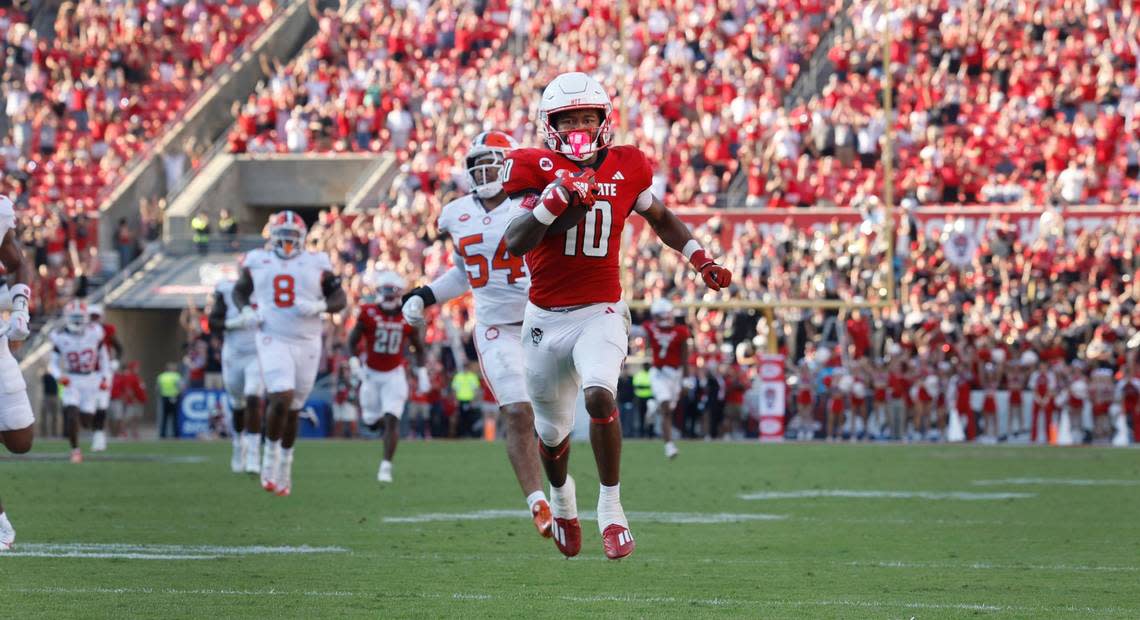 N.C. State wide receiver KC Concepcion (10) heads to the end zone to score on a 72-yard touchdown reception during the second half of N.C. State’s 24-17 victory over Clemson at Carter-Finley Stadium in Raleigh, N.C., Saturday, Oct. 28, 2023. Ethan Hyman/ehyman@newsobserver.com