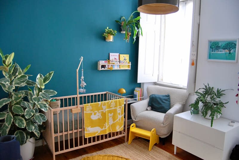 Corner view of teal nursery.