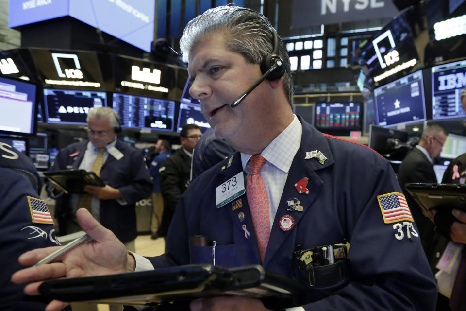 Trader John Panin works on the floor of the New York Stock Exchange, Monday, July 30, 2018. Stocks are off to a mixed start on Wall Street as gains in banks and energy companies are offset by losses in other sectors. (AP Photo/Richard Drew)