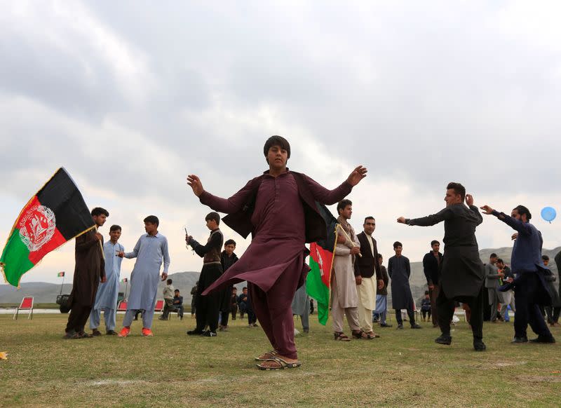 Afghan men celebrate in anticipation of the U.S-Taliban agreement to allow a U.S. troop reduction and a permanent ceasefire, in Jalalabad