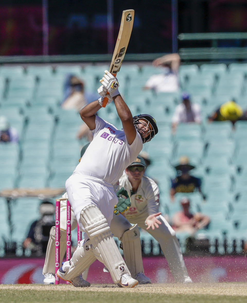 India's Rishabh Pant hits a six during play on the final day of the third cricket test between India and Australia at the Sydney Cricket Ground, Sydney, Australia, Monday, Jan. 11, 2021. (AP Photo/Rick Rycroft)