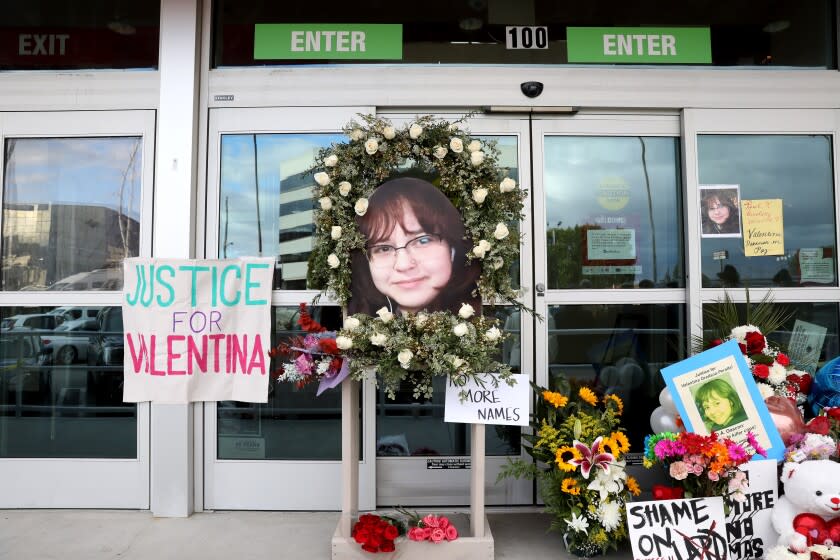 NORTH HOLLYWOOD, CA - DECEMBER 28: A memorial for Valentina Orellana Peralta at the door of the Burlington Coat Factory. The League of United Latin American Citizens seeks answers in the killing of 14-year-old Valentina Orellana Peralta, requesting a full investigation and meeting with Los Angeles Police Chief Michel Moore and Mayor Eric Garcetti, in a press conference at the Burlington Coat Factory on Tuesday, Dec. 28, 2021 in North Hollywood, CA. The site where a 14-year-old girl was shot and killed when LAPD was trying to apprehend an individual inside the store. The suspect Daniel Elena-Lopez was killed, as was Valentina Orellana-Peralta, a 14-year-old trying on clothes in a dressing room nearby. (Gary Coronado / Los Angeles Times)