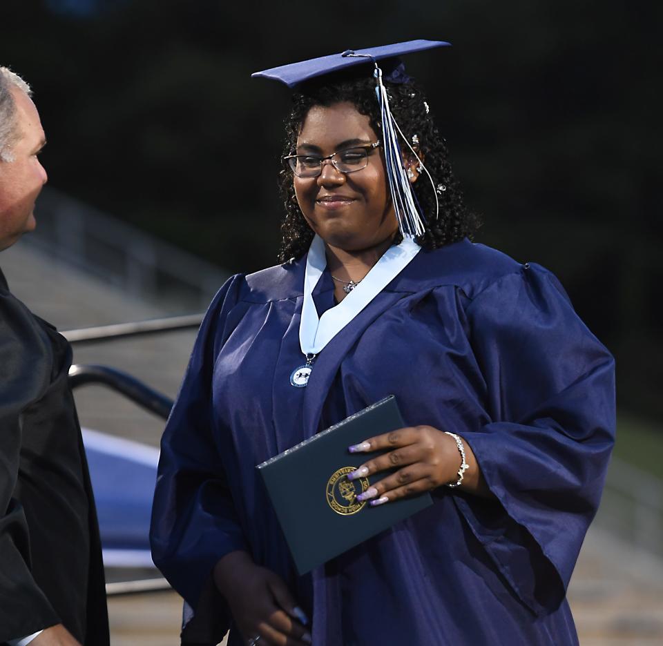 Dorman High School's Class of 2024 had 912 graduates; the largest ever in the school's history. This year Dorman was the largest high school in the state. Lana Cedeno reacts during her graduation 'Walk' as she gets her diploma.