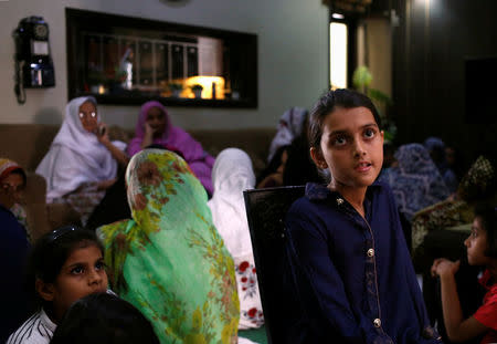 Soha Aziz Shaikh 10, sister of Sabika Aziz Sheikh, a Pakistani exchange student, who was killed with others when a gunman attacked Santa Fe High School in Santa Fe, Texas, U.S., sits in a room with relatives, at her residence in Karachi, Pakistan May 19, 2018. REUTERS/Akhtar Soomro