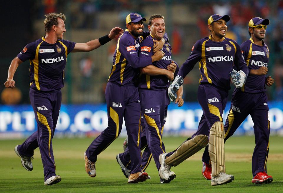 Kolkata Knight Riders bowler Jacques Kallis, center, celebrates with teammates the dismissal of Royal Challengers Bangalore batsman Chris Gayle, not seen, during their Indian Premier League (IPL) cricket match in Bangalore, India, Tuesday, April 10, 2012. (AP Photo/Aijaz Rahi)