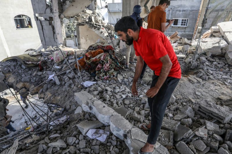 Palestinians check the damage in the aftermath of an Israeli airstrike in Rafah, in the southern Gaza Strip, on Friday, May 3, 2024. The bombing resulted in the death of seven members of one family, according to medical sources. The U.N.'s International Court of Justice Friday ordered Israel to stop its military assault on Rafah. Photo by Ismael Mohamad/UPI