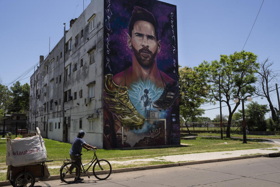 A mural of Lionel Messi a building near his former elementary school in Rosario, Argentina, Wednesday, Dec. 14, 2022. (AP Photo/Rodrigo Abd)