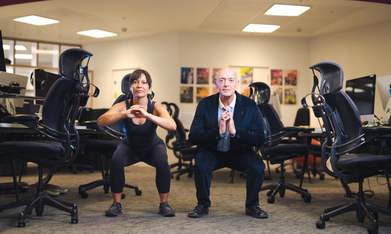 <span>Sarah Aarons takes Phil Daoust through a basic squat.</span><span>Photograph: Alecsandra Raluca Drăgoi/The Guardian</span>