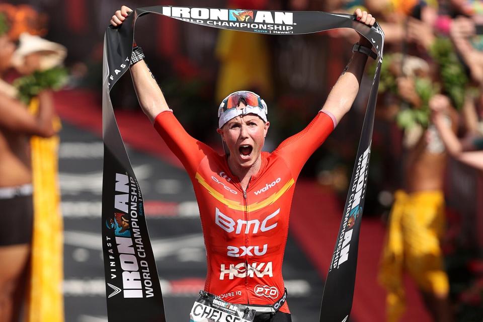 Chelsea Sodaro celebrates after winning the Ironman World Championships on October 06, 2022 in Kailua Kona, Hawaii.